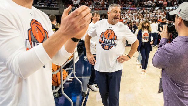 Auburn Tigers head coach Bruce Pearl walks the court before Auburn Tigers men's basketball takes on Texas A&M Aggies at Auburn Arena in Auburn, Ala., on Saturday, Feb. 12, 2022. Auburn Tigers lead Texas A&M Aggies 33-18 at halftime.